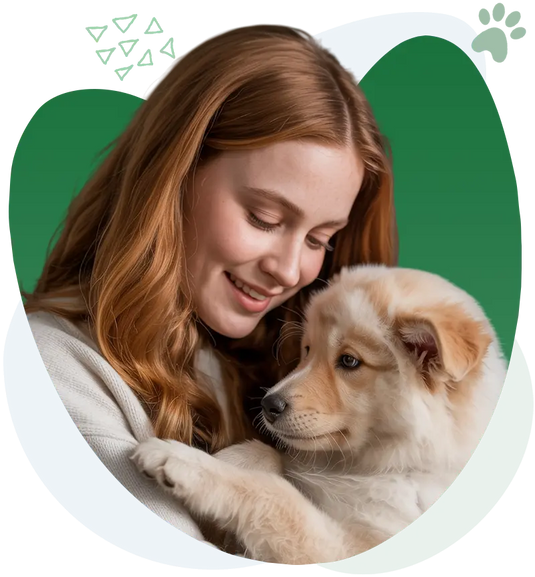 Woman holding a happy puppy, representing the bond between pets and their owners.